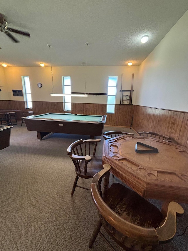 interior space featuring ceiling fan, a textured ceiling, billiards, and a healthy amount of sunlight