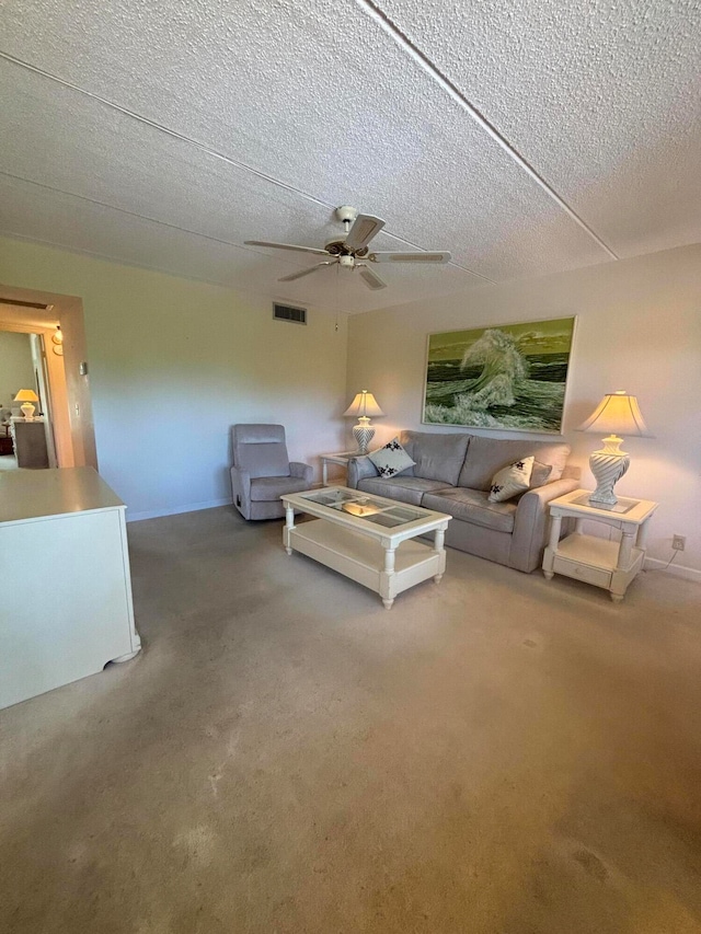 unfurnished living room featuring ceiling fan, carpet flooring, and a textured ceiling