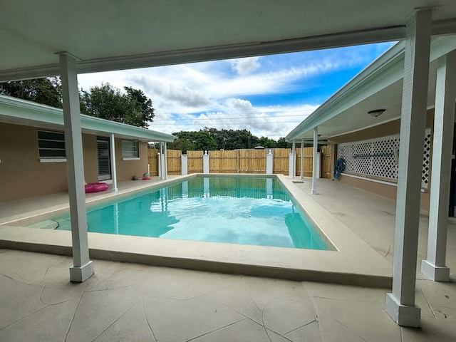 view of swimming pool featuring a patio area