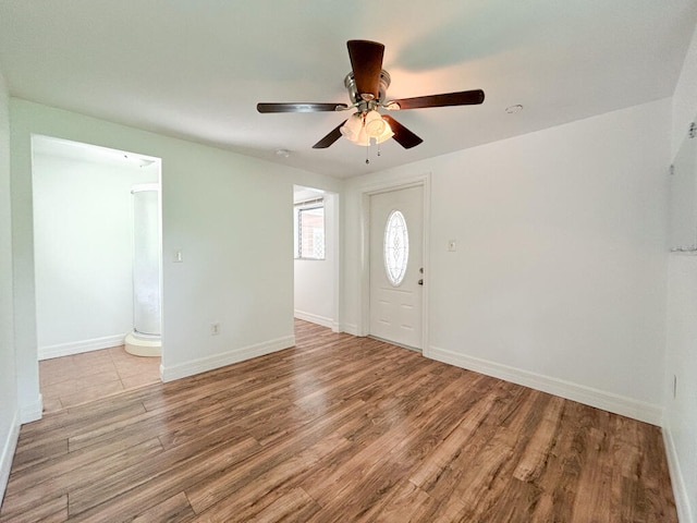 foyer entrance featuring ceiling fan and light hardwood / wood-style flooring