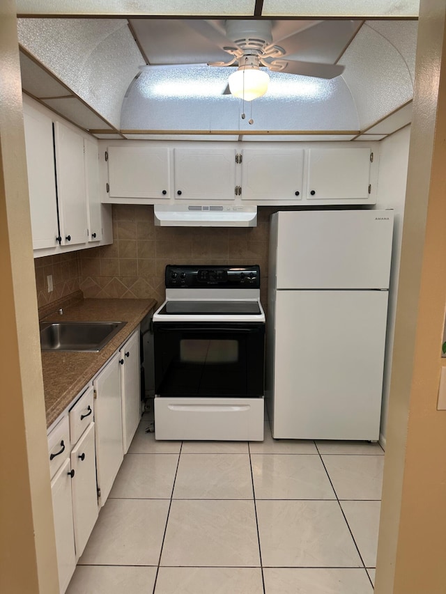 kitchen featuring white cabinets, sink, and white appliances