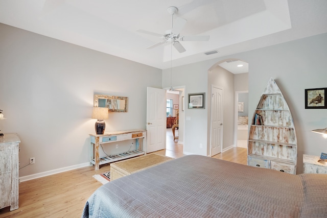 bedroom with ceiling fan, light hardwood / wood-style flooring, and a closet