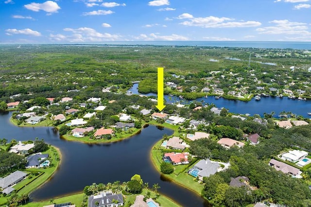 birds eye view of property featuring a water view