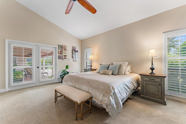 carpeted bedroom featuring access to exterior, high vaulted ceiling, and ceiling fan