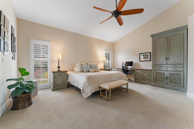 carpeted bedroom featuring ceiling fan and high vaulted ceiling