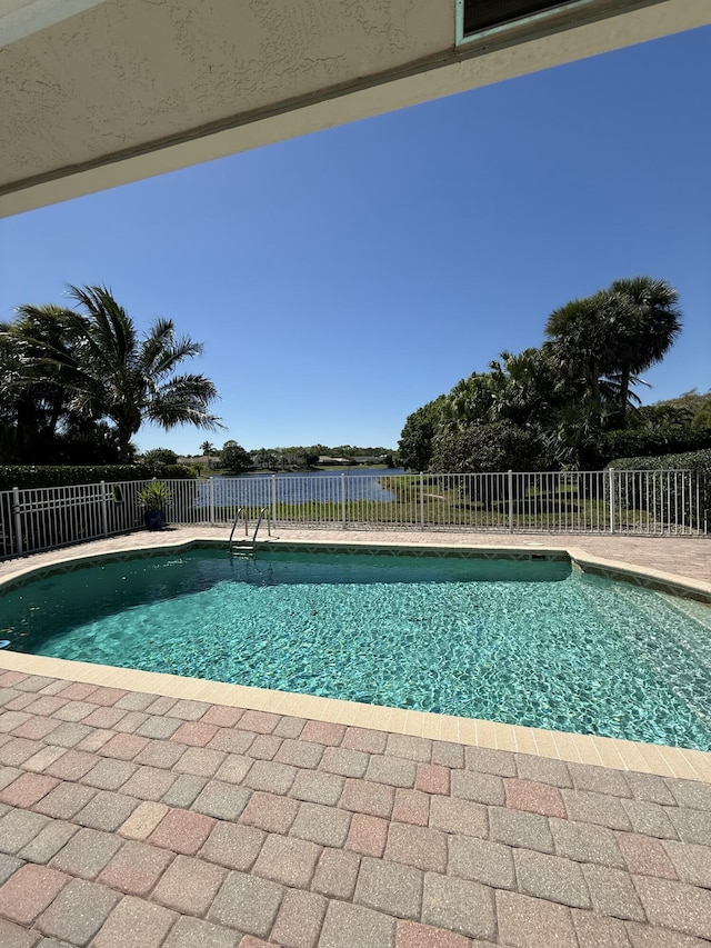 view of pool featuring a patio area, fence, and a fenced in pool