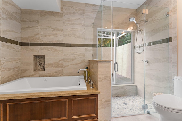 bathroom with independent shower and bath, tile walls, and toilet