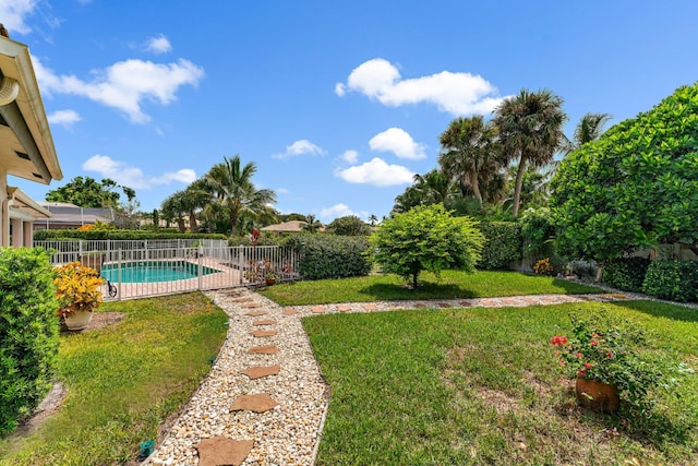 view of yard with a fenced in pool