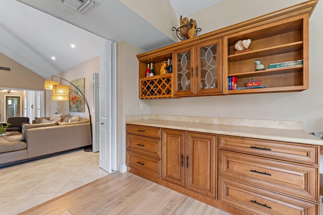 exercise room with plenty of natural light, ceiling fan, and light tile patterned floors