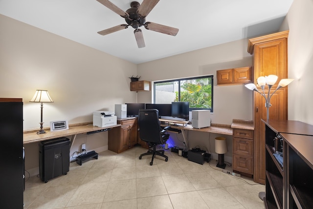 tiled office space featuring ceiling fan