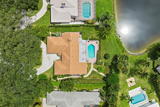 pool at dusk featuring a patio