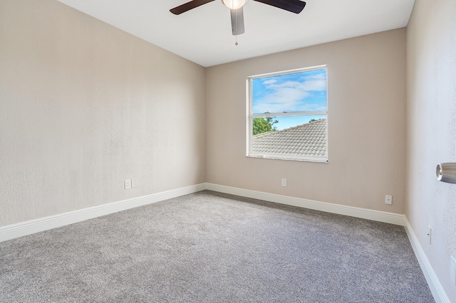 carpeted empty room with ceiling fan