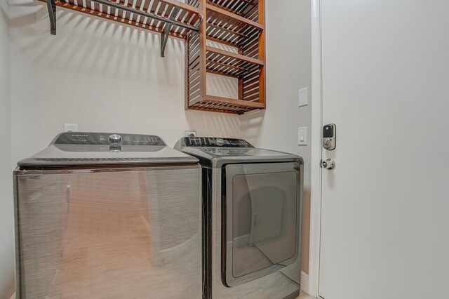 washroom featuring washing machine and dryer