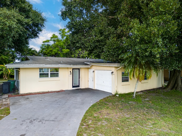 view of front facade with a garage and a front yard