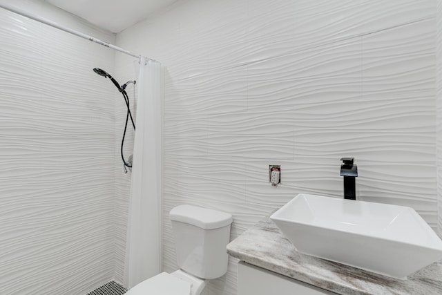 bathroom featuring a shower with curtain, vanity, tile walls, and toilet