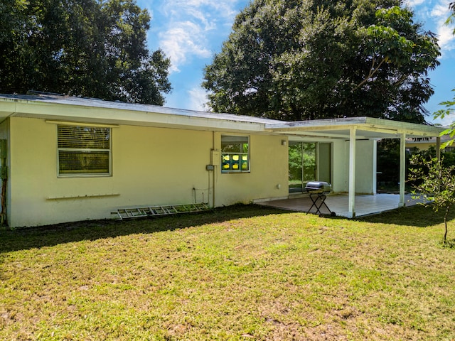 exterior space featuring a yard and a patio