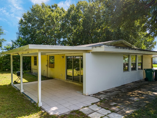 back of house with a patio area