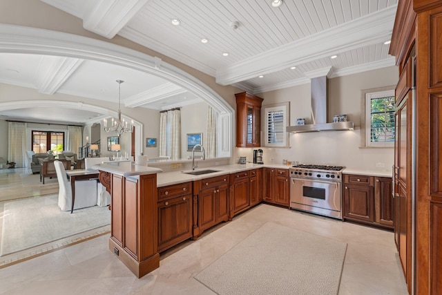 kitchen with high end stainless steel range oven, ventilation hood, beam ceiling, an inviting chandelier, and sink