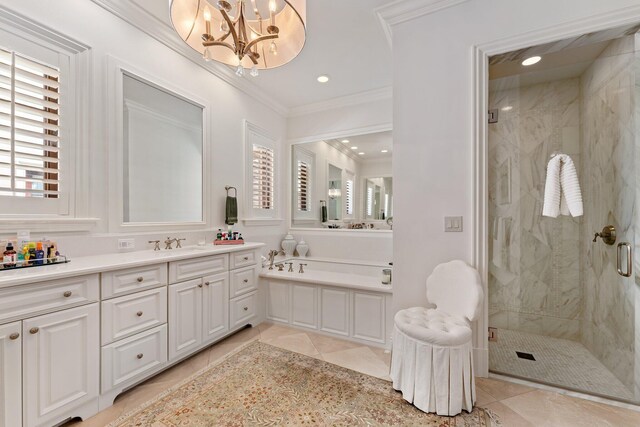 bathroom with vanity, independent shower and bath, tile patterned floors, an inviting chandelier, and crown molding