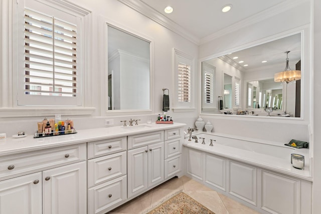 bathroom with vanity, a bathing tub, a notable chandelier, crown molding, and tile patterned flooring