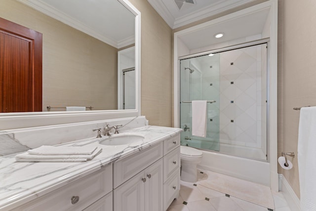 full bathroom with ornamental molding, vanity, toilet, and combined bath / shower with glass door