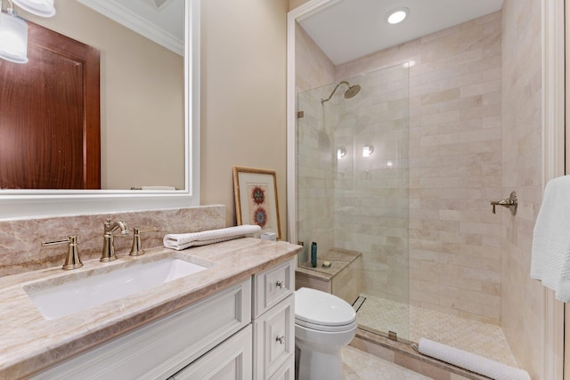 bathroom featuring walk in shower, crown molding, vanity, and toilet