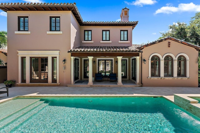 rear view of property featuring a patio area