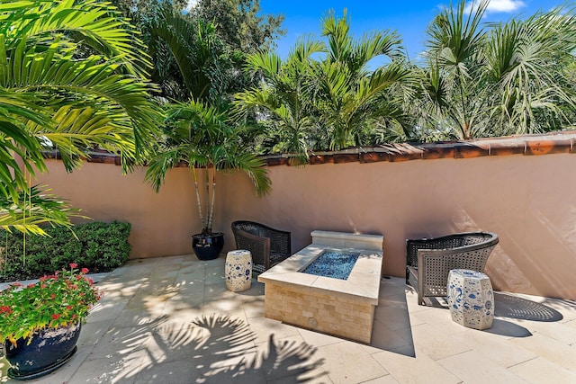 view of patio featuring an outdoor fire pit