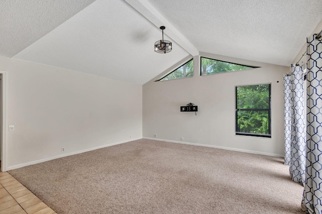 unfurnished living room featuring carpet floors and lofted ceiling with beams