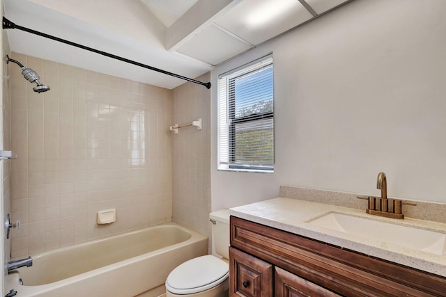 full bathroom with tiled shower / bath combo, vanity, and toilet