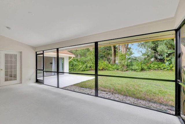 unfurnished sunroom with vaulted ceiling