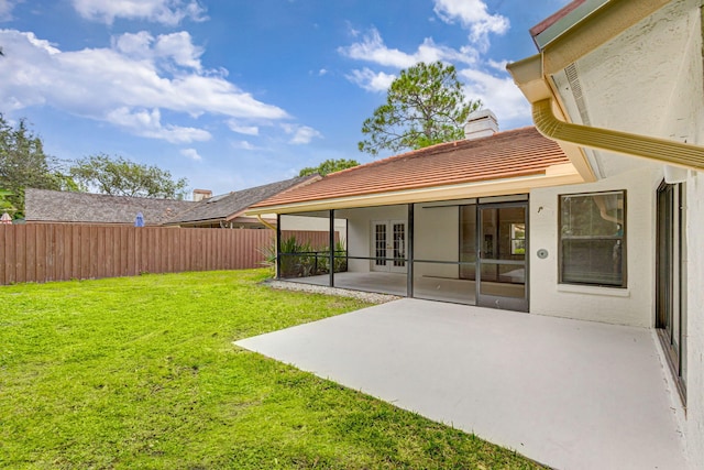 view of yard featuring french doors and a patio area