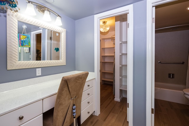 bathroom featuring hardwood / wood-style flooring, vanity, and toilet