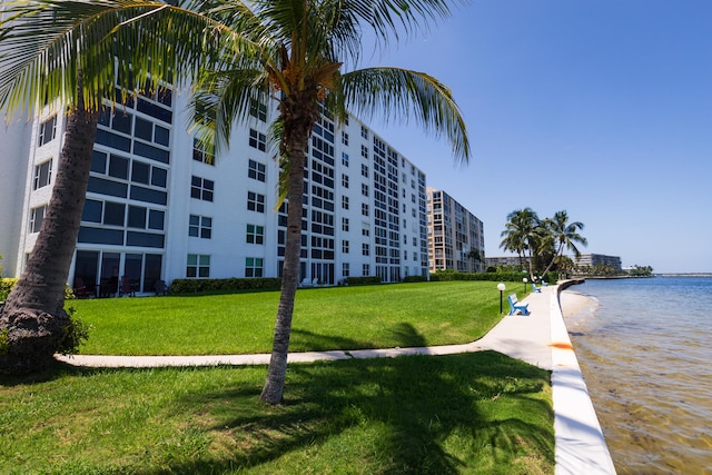 exterior space with a lawn and a water view