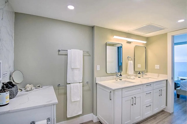 bathroom featuring vanity and hardwood / wood-style flooring