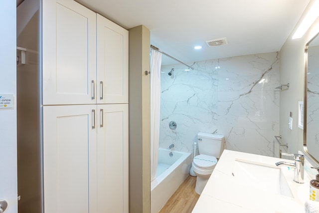 full bathroom featuring shower / bath combo, vanity, toilet, tile walls, and wood-type flooring