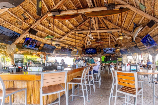 kitchen with ceiling fan and lofted ceiling