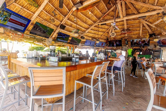 exterior space featuring a gazebo, ceiling fan, and an outdoor bar