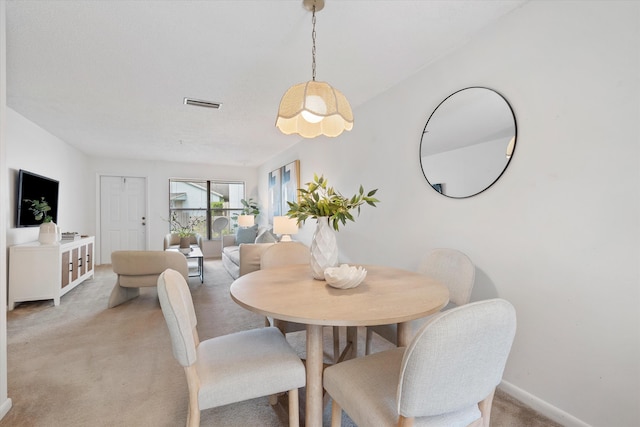 view of carpeted dining space