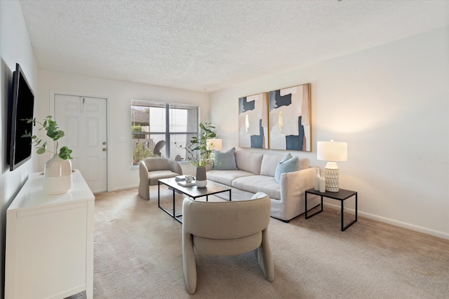 living room with a textured ceiling and light colored carpet