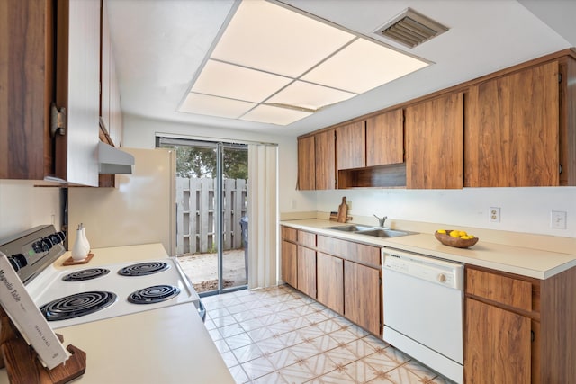 kitchen with sink and white appliances