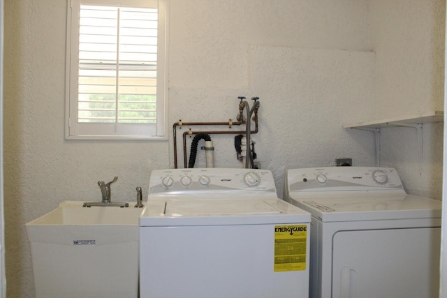 laundry area featuring separate washer and dryer and sink