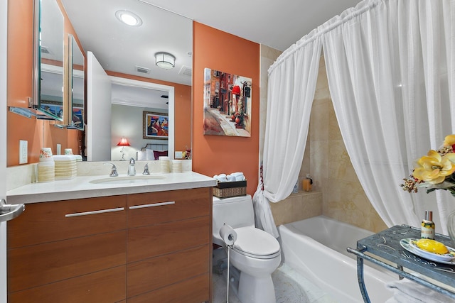 full bathroom with toilet, shower / bath combo with shower curtain, vanity, and visible vents