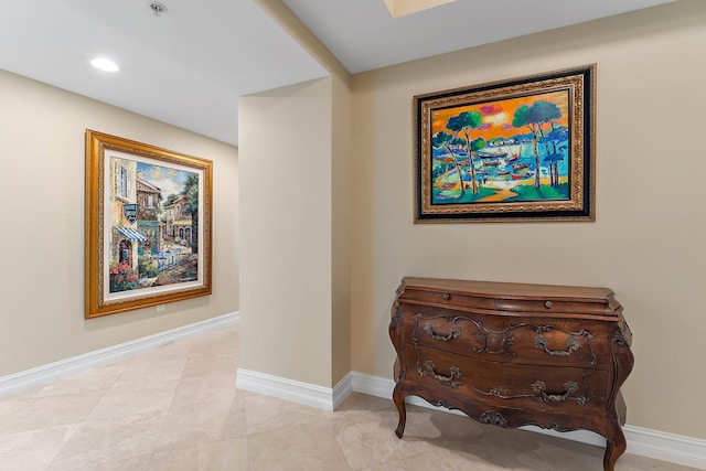 interior space featuring recessed lighting and baseboards