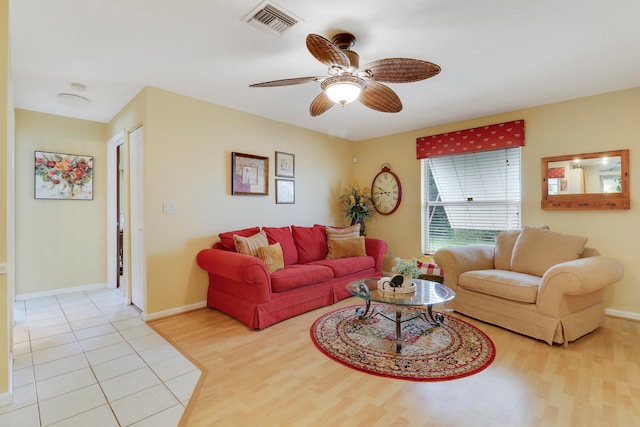 living room with ceiling fan and light hardwood / wood-style floors