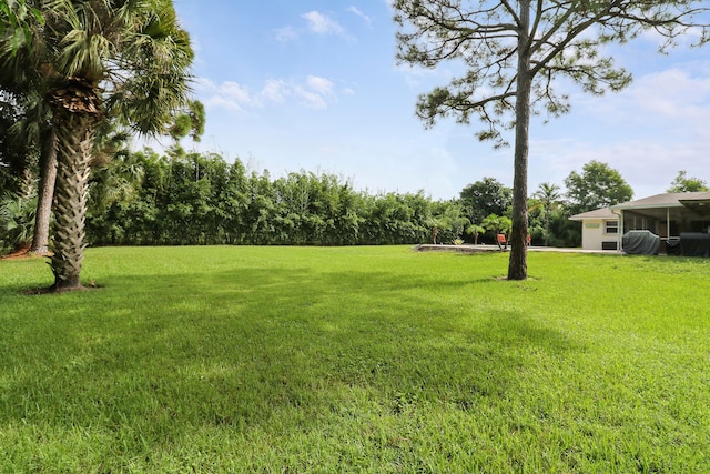 view of yard with a sunroom