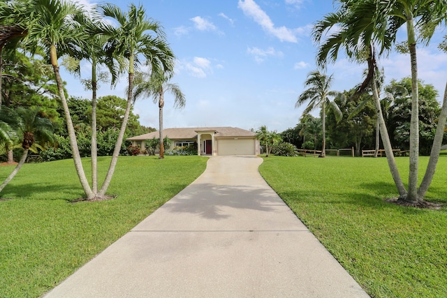 ranch-style home with a front lawn and a garage