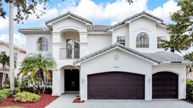 mediterranean / spanish-style house featuring a garage