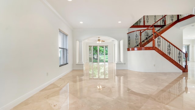 interior space featuring decorative columns and crown molding