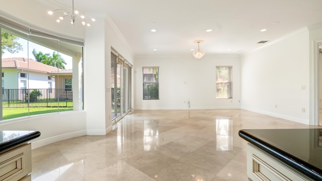 interior space with crown molding and a notable chandelier